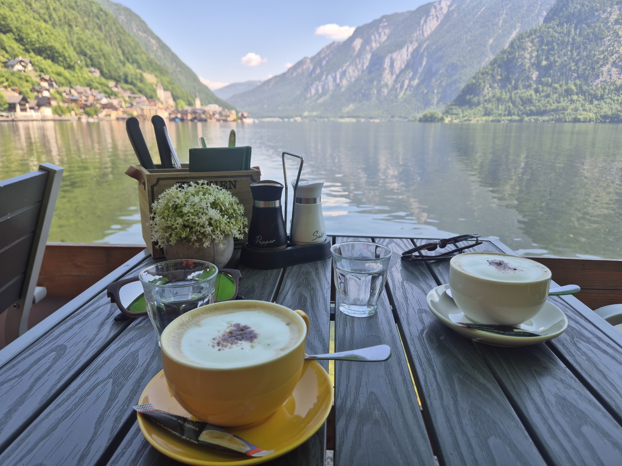 Cappuccinos served against the lake and mountain panorama